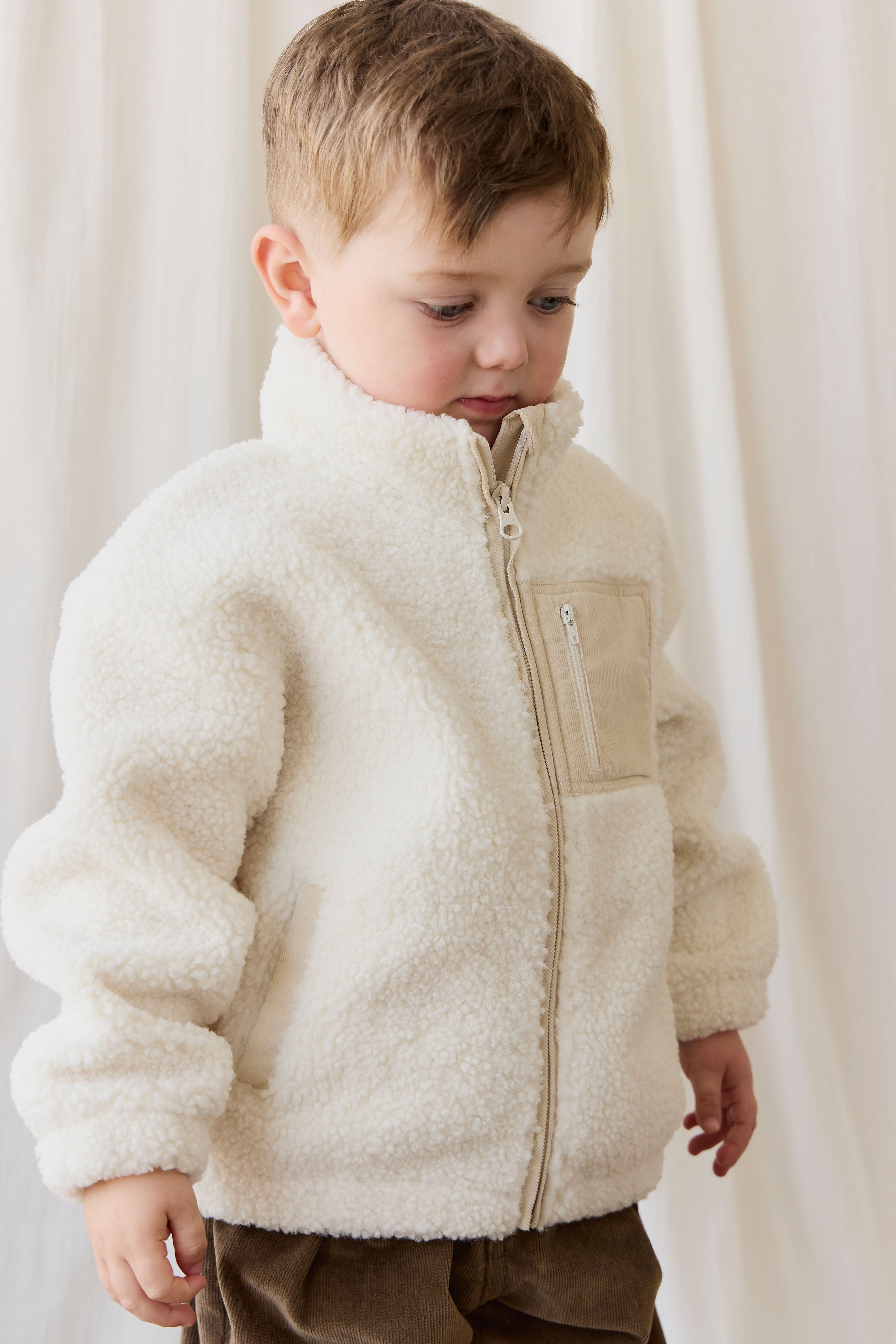 Veste zippée enfant en polaire sherpa crème avec col montant