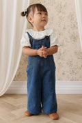 Salopette large en jean indigo classique pour fille avec bretelles boutonnées