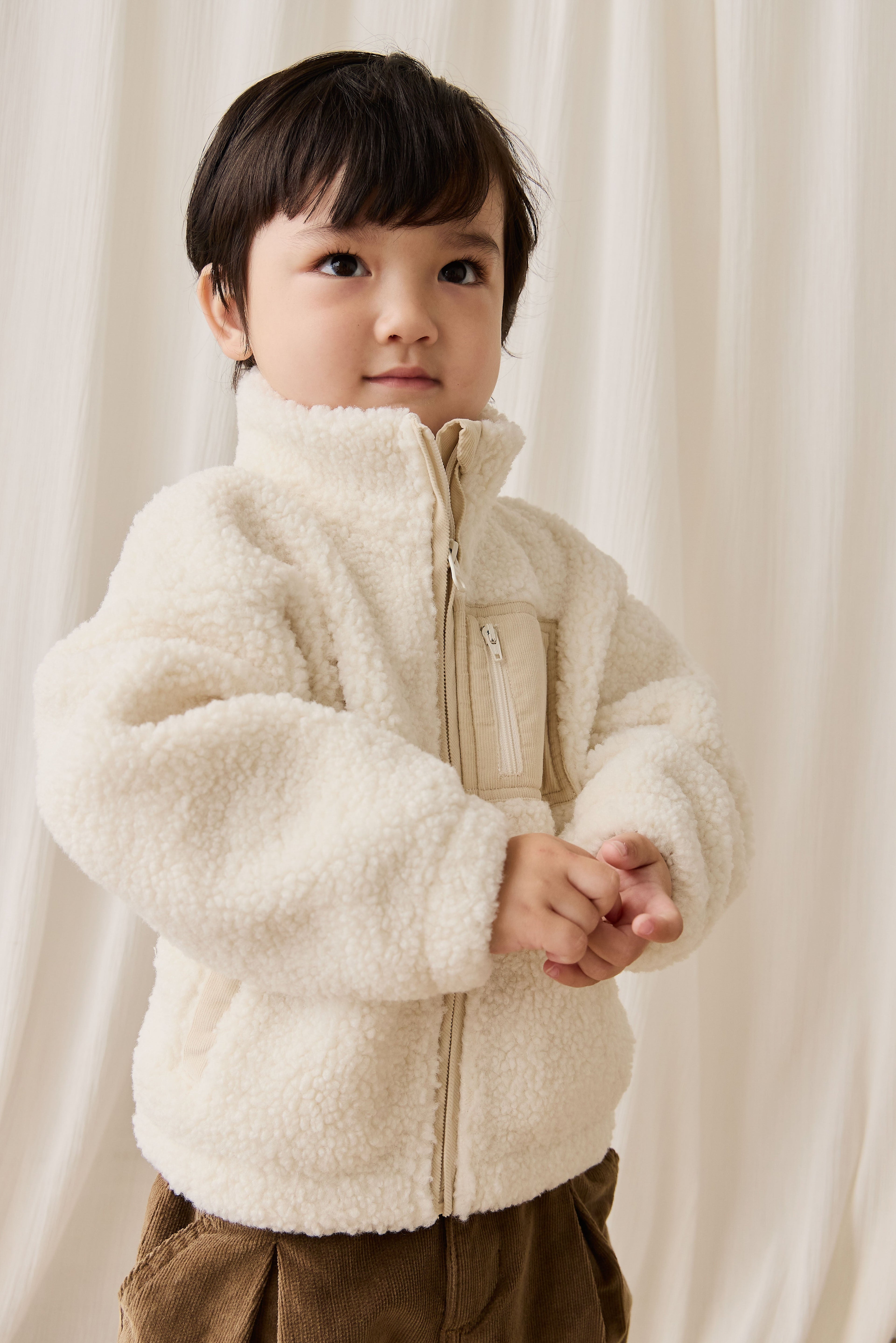 Veste zippée enfant en polaire sherpa crème avec col montant