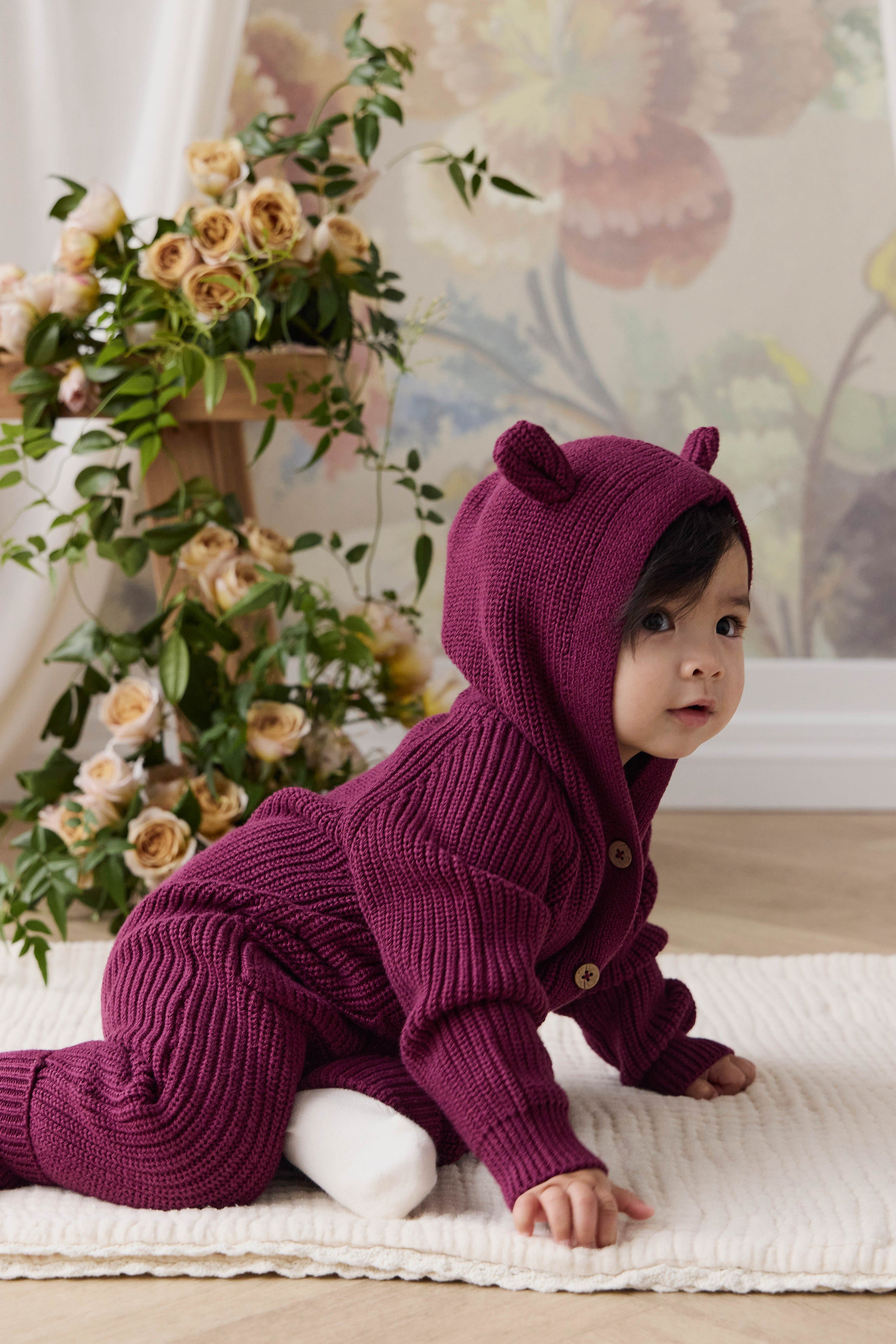 Grenouillère bébé en tricot à capuche avec oreilles d'ours et boutons en coton douillet